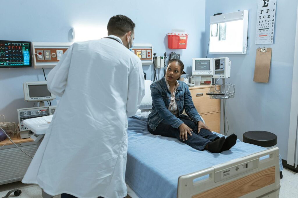 A photo of a doctor examining a patient in a hospital setting, emphasizing the importance of timely medical treatment for …
