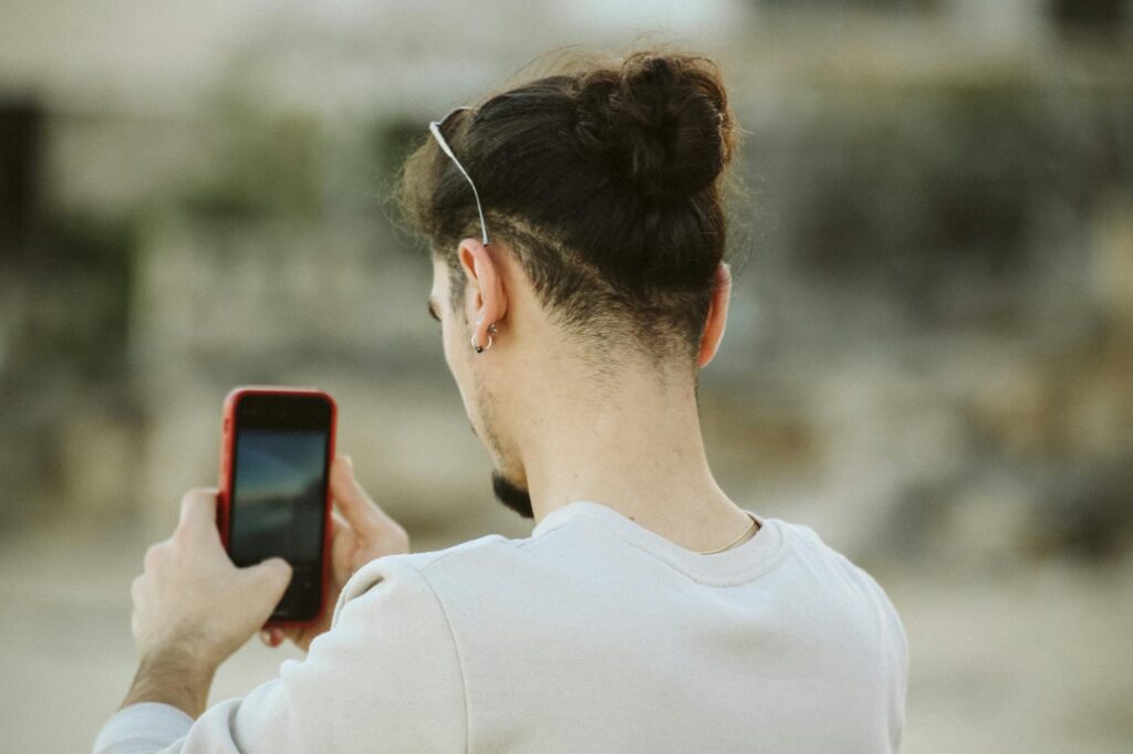 A photo of a person documenting their injuries with a smartphone. — build strong case injury claim