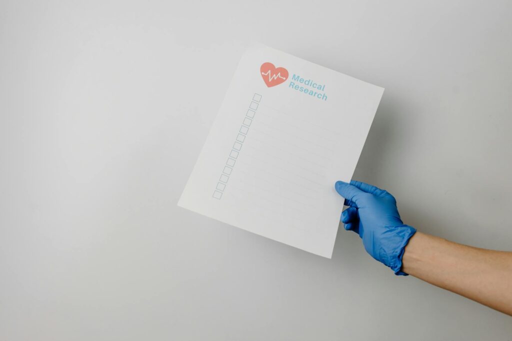 A photo of medical documents and a checklist for gathering evidence. — factors affecting injury claim settlement