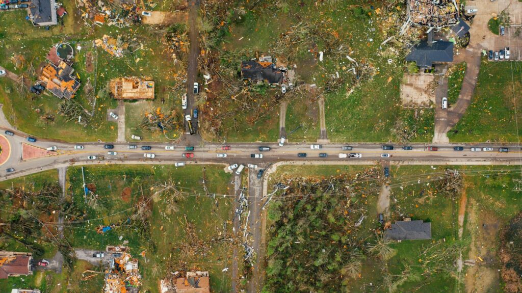 An aerial view of a drone assessing property damage. — future of insurance adjusting