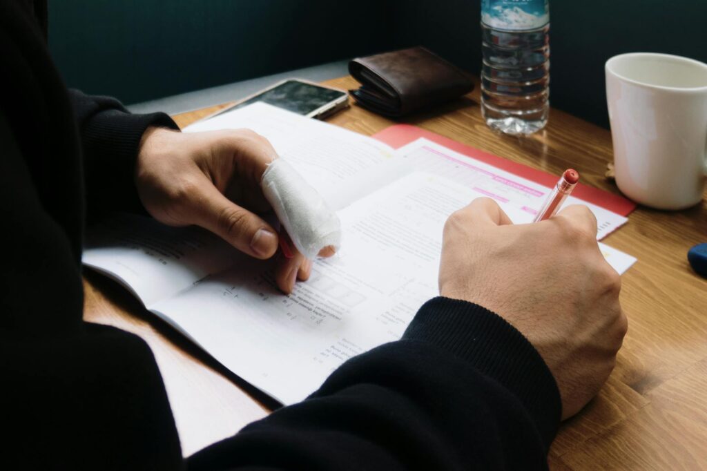 Illustration of a person gathering documentation for their injury claim — insurance company tactics injury claim