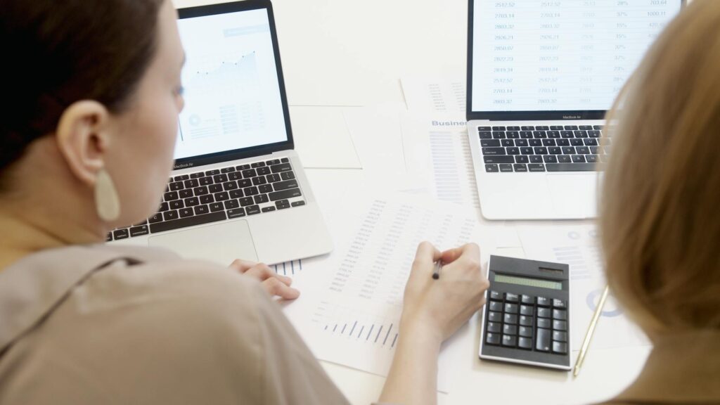 A depiction of a person consulting a professional while calculating their injury claim. — mistakes injury claim calculator
