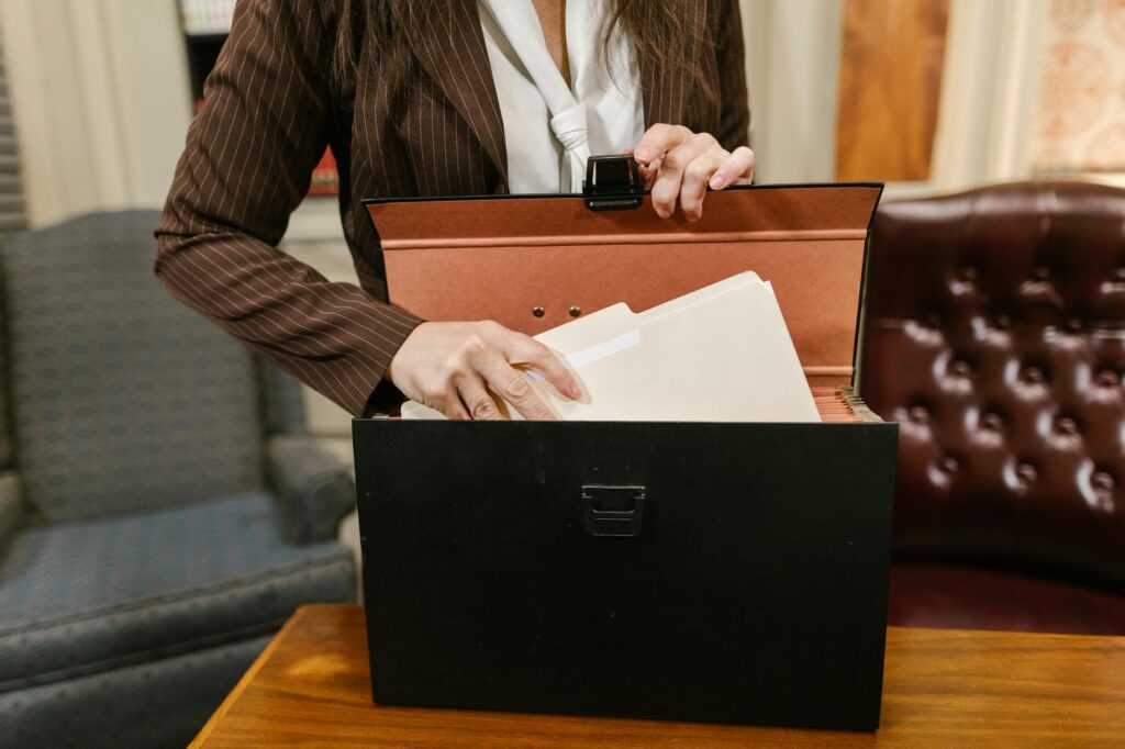 A person organizing their files and documentation in preparation for a lawyer meeting. — Injury claim lawyer consultation