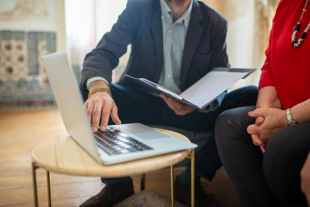 A photo of a lawyer discussing a case with a client, focusing on injury claim value mistakes
