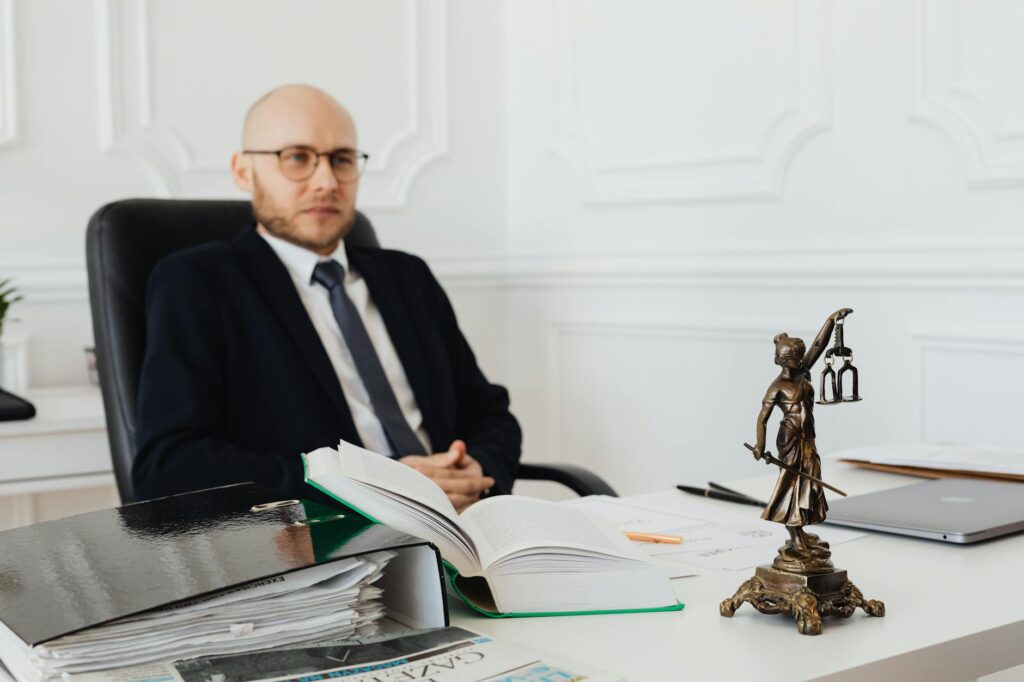A photo of a personal injury lawyer consulting with a client about the mistakes filing injury claim.