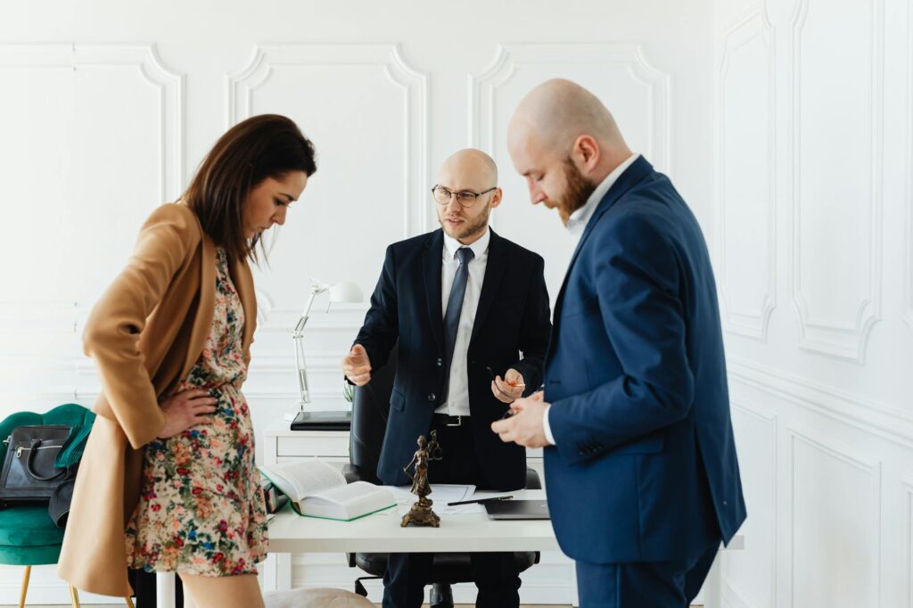 A professional discussing injury claims with a client — injury claim calculator myths