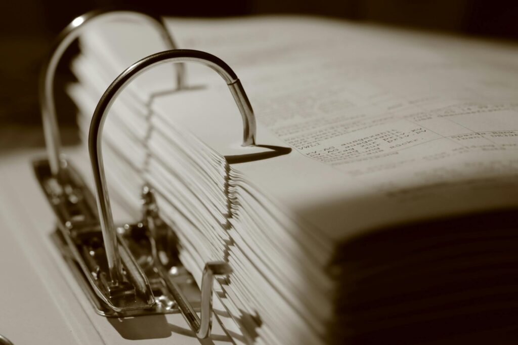 An organized binder filled with documentation for an injury claim. — documentation for injury claim