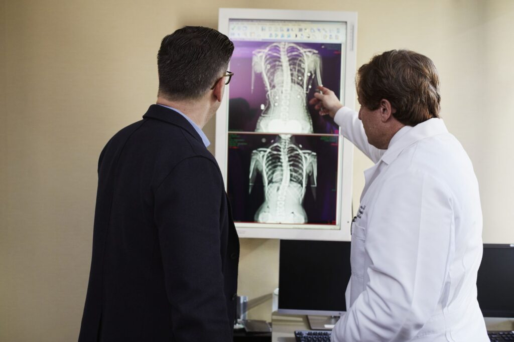 A doctor explaining medical evidence to a patient — medical documentation injury claims