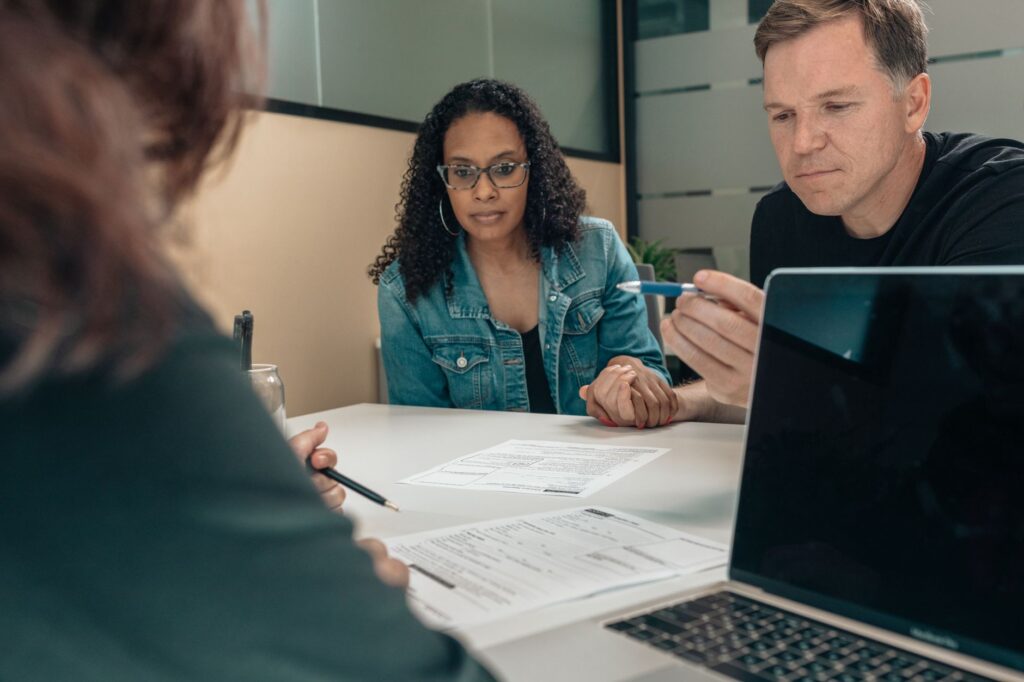 A photo of a legal consultation regarding an injury claim, illustrating the complexities involved in settling an injury claim timeline.