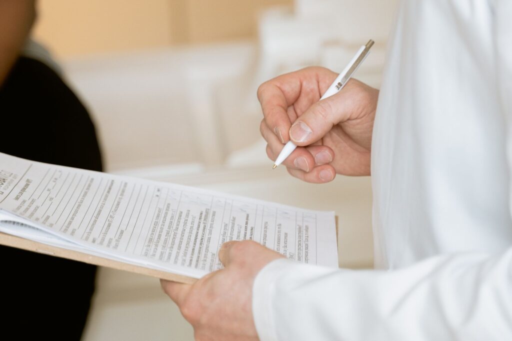 A photo of a medical consultation to emphasize the importance of documentation — medical bills settlement