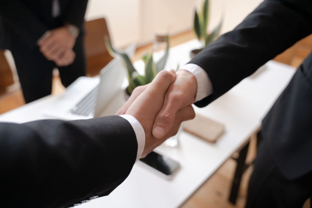 A photo of a professional negotiation setting, depicting a negotiation in progress. — injury claim settlement negotiation