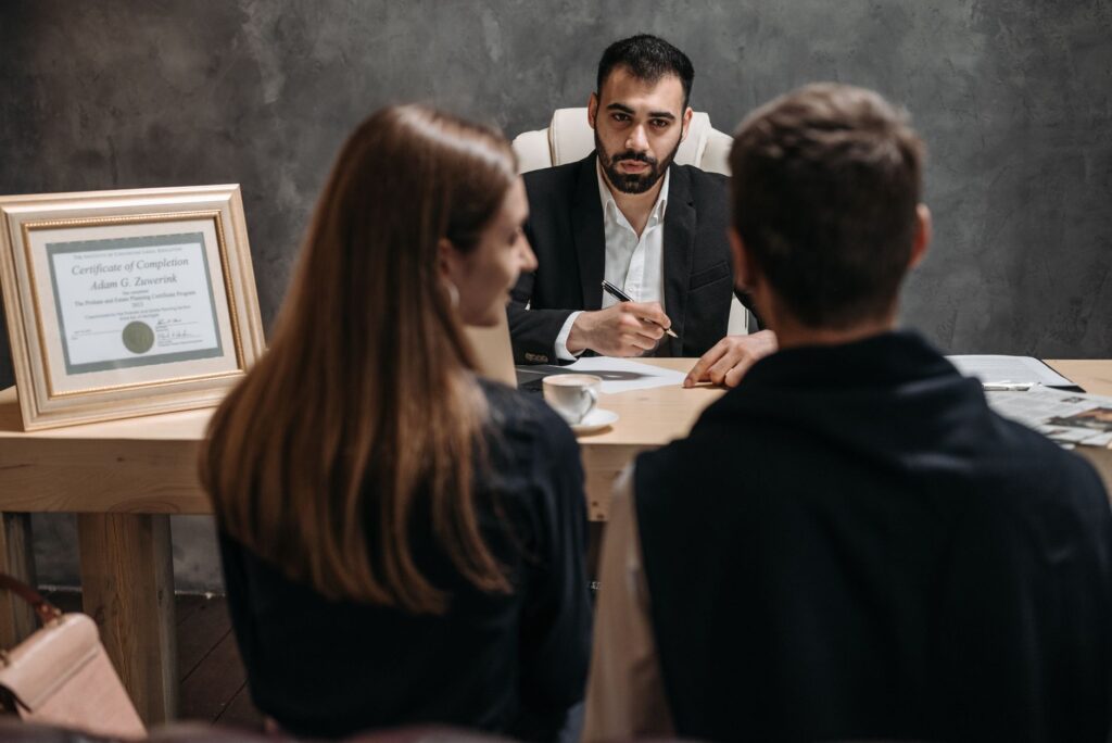 An image depicting a grieving family discussing their options with a legal advisor. — wrongful death settlement calculator