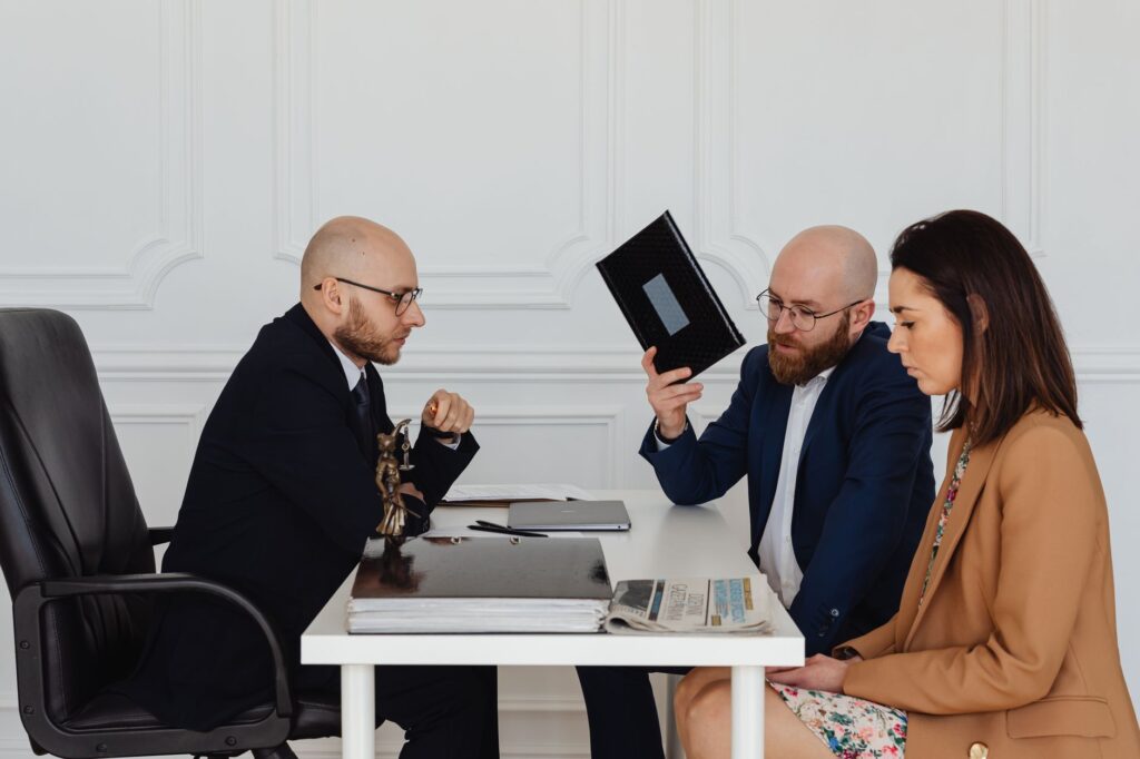 An image of an attorney consulting with a client about their injury claim, focusing on pain and suffering calculations.