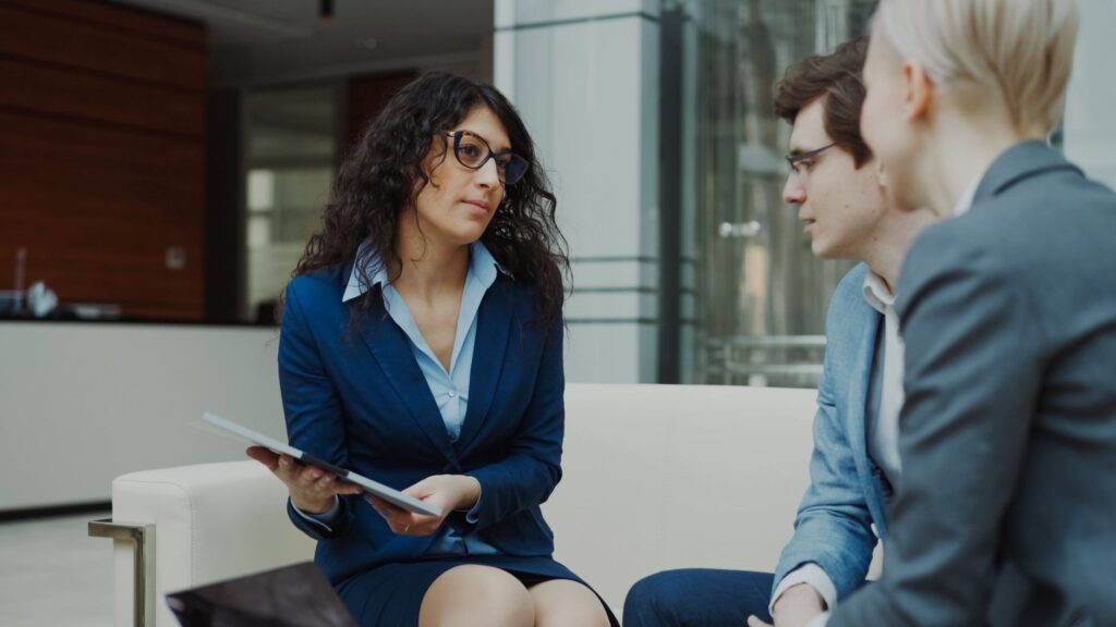 Image of a professional advisor discussing settlement strategies with a client. — accept first settlement offer