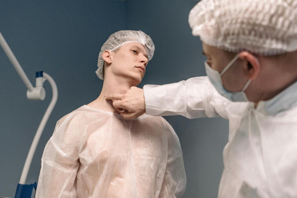 Photo of a medical professional examining a patient with a neck injury — neck injury settlement average