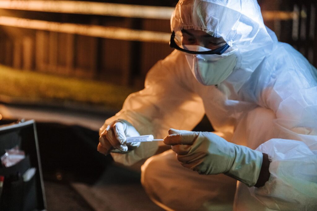 photo of a person gathering evidence at an accident scene — filing an injury claim