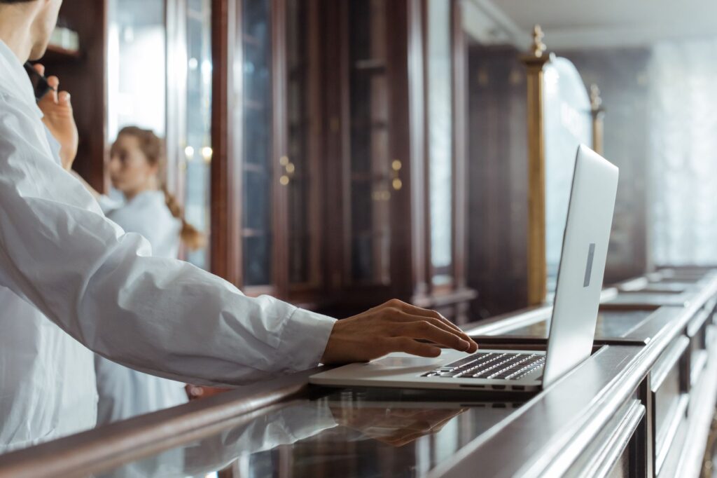 A person using a laptop to research personal injury attorneys. — choosing injury lawyer