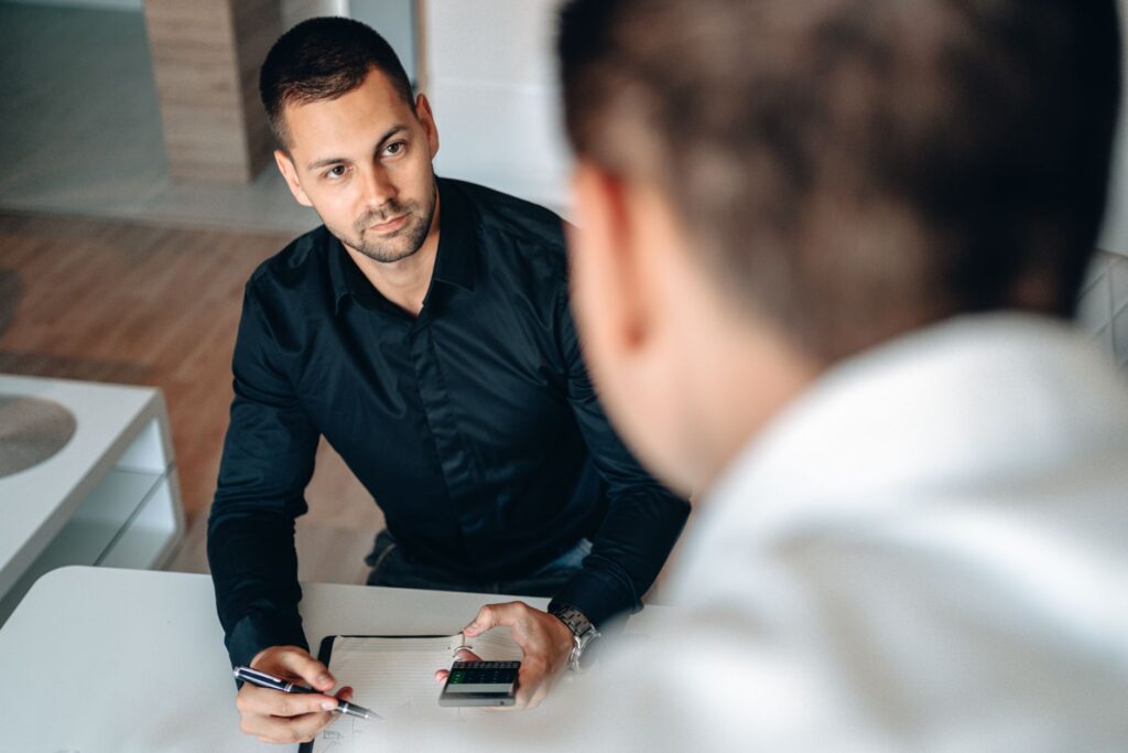 A photo of a financial planner working with a client on medical expense projections — future medical expenses injury claim