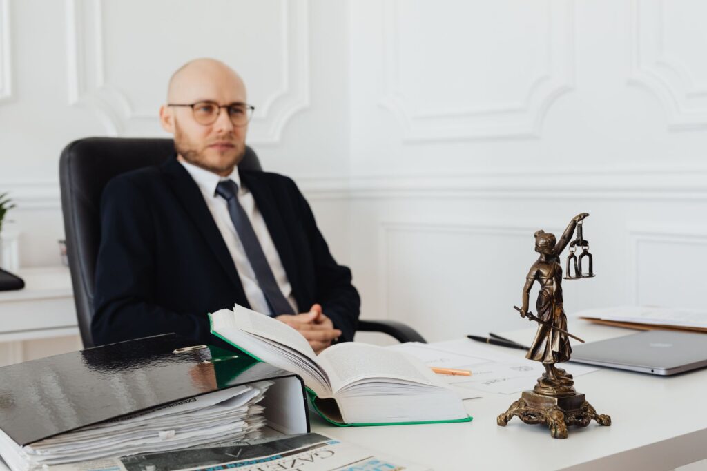 A photo of a lawyer consulting with a client about their injury case. — pain and suffering claims