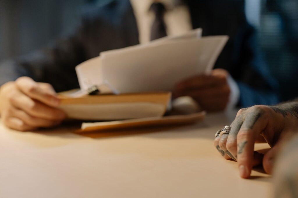 A picture of a lawyer reviewing case documents and evidence related to a claim. — lawyer increase settlement