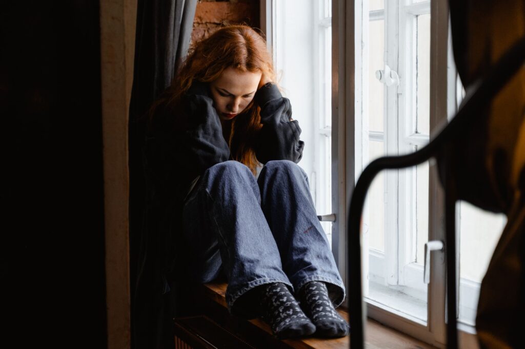 An image depicting emotional distress with a person in a contemplative state. — pain and suffering claims