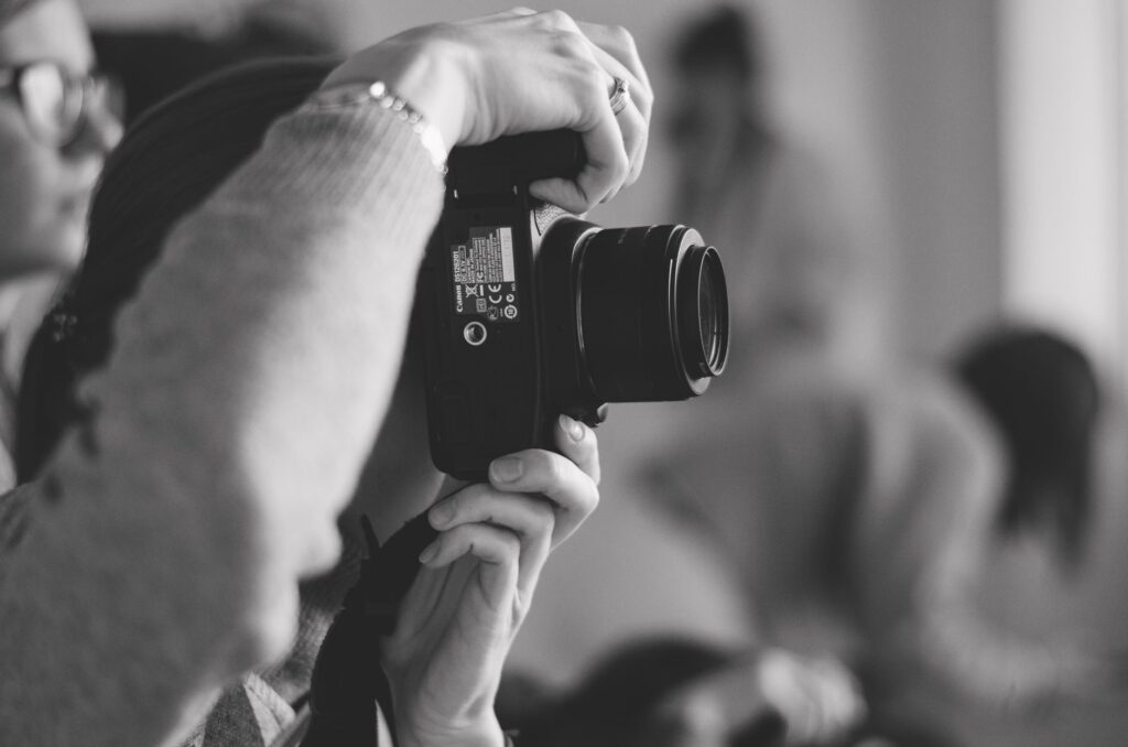 An image of a person taking photographs at an accident scene. — evidence for injury claim
