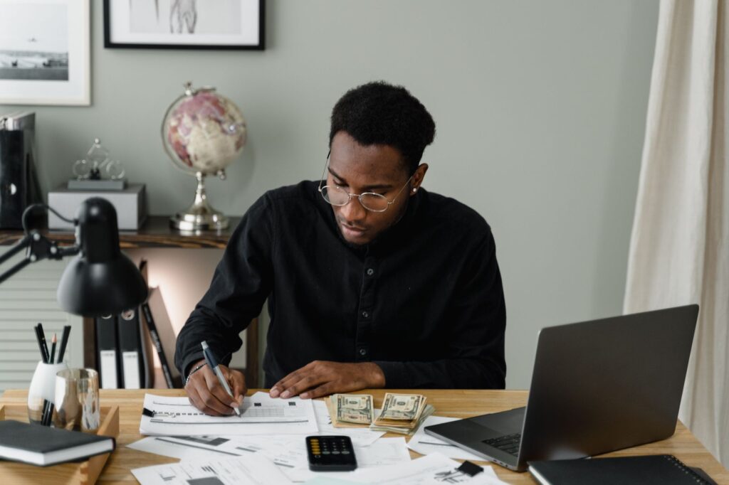 Image depicting a person documenting medical expenses after an accident. — injury claim settlement factors