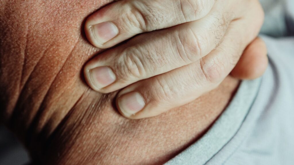Image of a person in pain representing physical suffering in injury claims. — pain and suffering claims