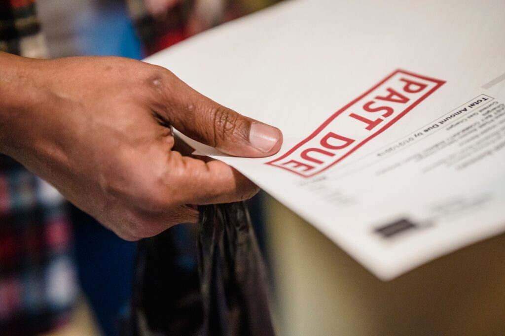 Photo of a person collecting medical bills and documents — when to use injury claim calculator