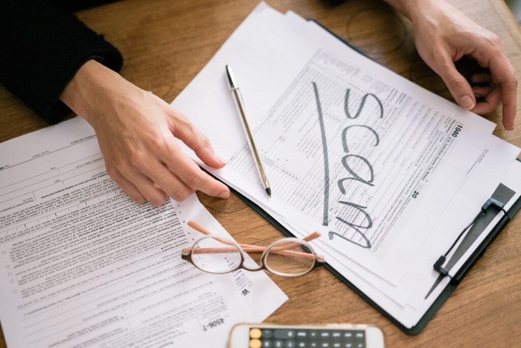 A close-up of legal documents and a calculator to symbolize injury claims. — need lawyer injury claim calculator