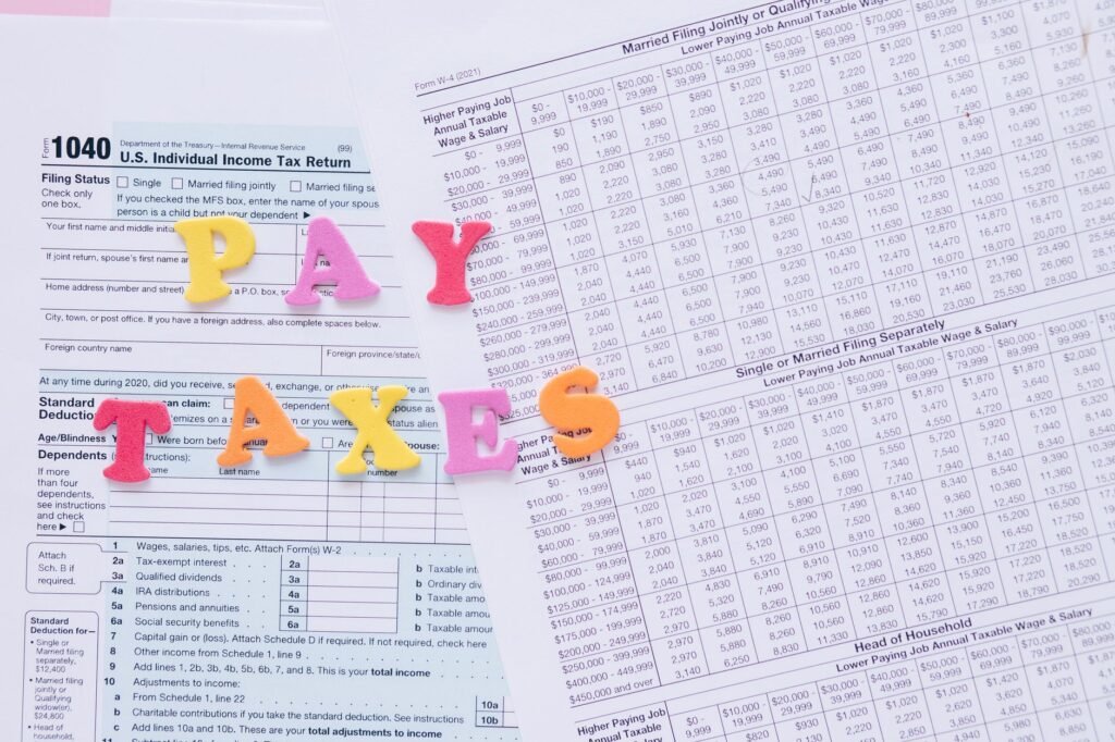 A close-up of pay stubs and tax returns used for lost wages documentation. — lost wages calculation injury claim