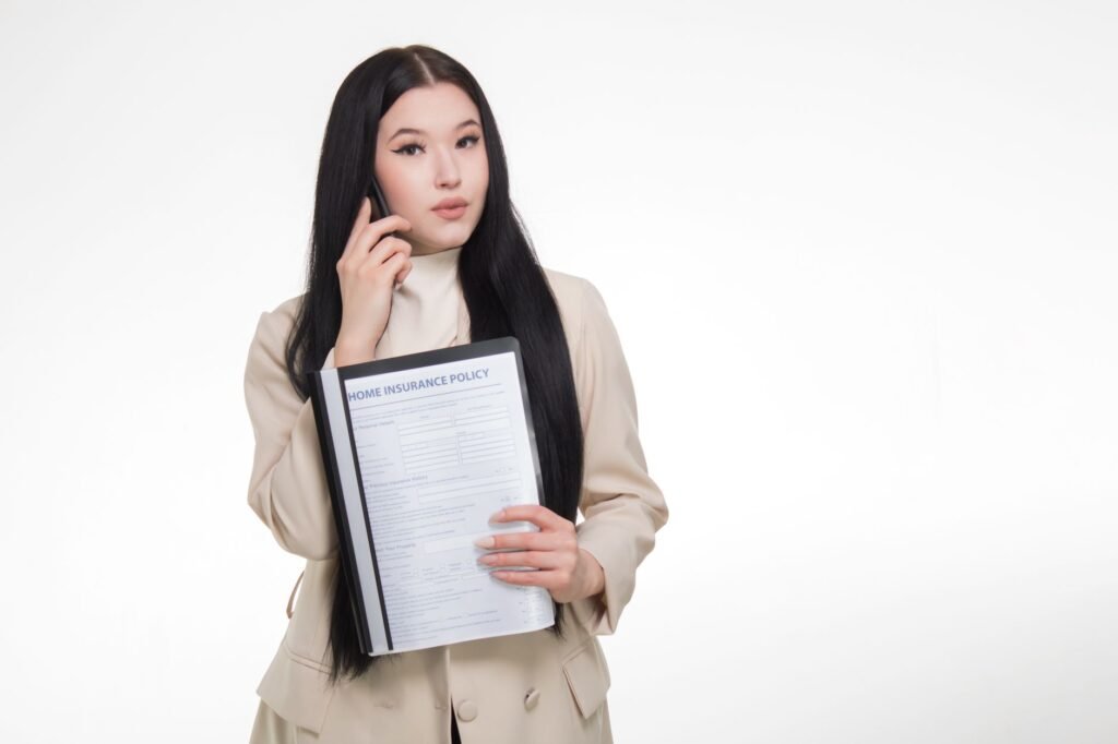 A person negotiating with an insurance adjuster over the phone. — insurance companies injury claims