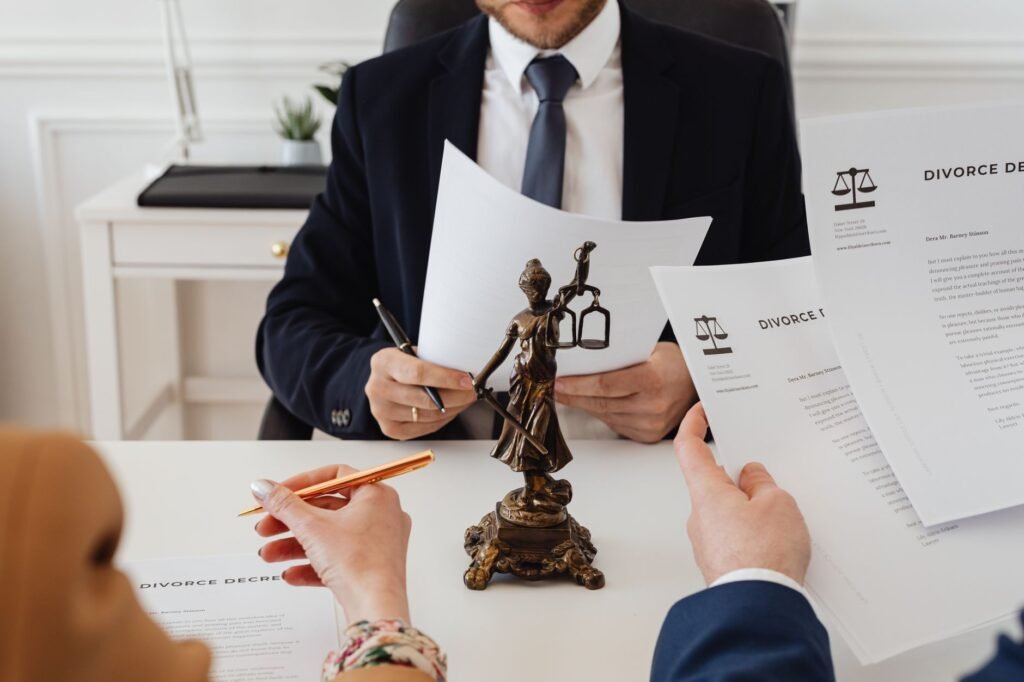 A photo depicting a person consulting with a lawyer about their injury claim, highlighting mistakes in filing injury claims.