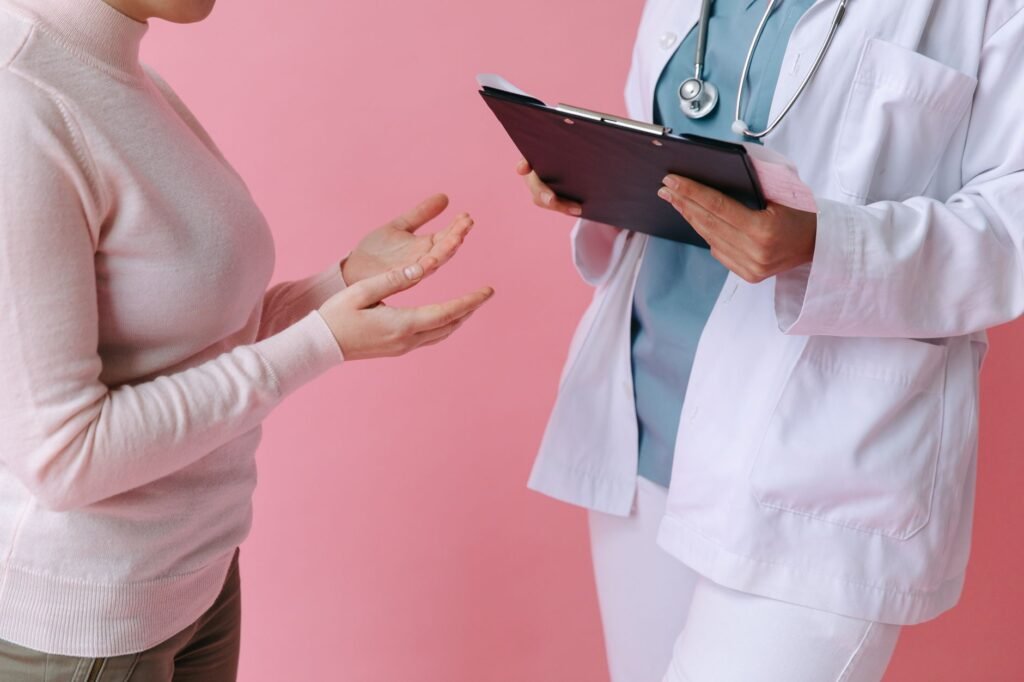 A photo of a healthcare provider discussing medical bills with a patient. — medical expenses injury claim