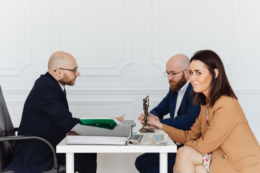A photo of a legal professional discussing a case with a client. — factors affecting injury claim settlement