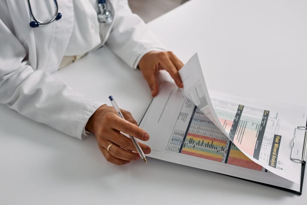A photograph of a healthcare professional reviewing a patient's medical records. — medical documentation injury claims