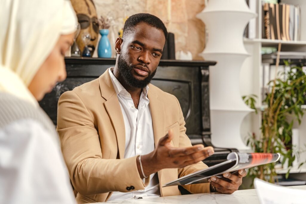 A professional discussing evidence with a client in an office setting. — gathering evidence for injury claim