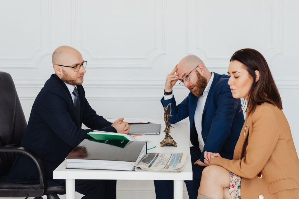 A professional setting with a lawyer discussing a settlement with a client. — injury settlement negotiation