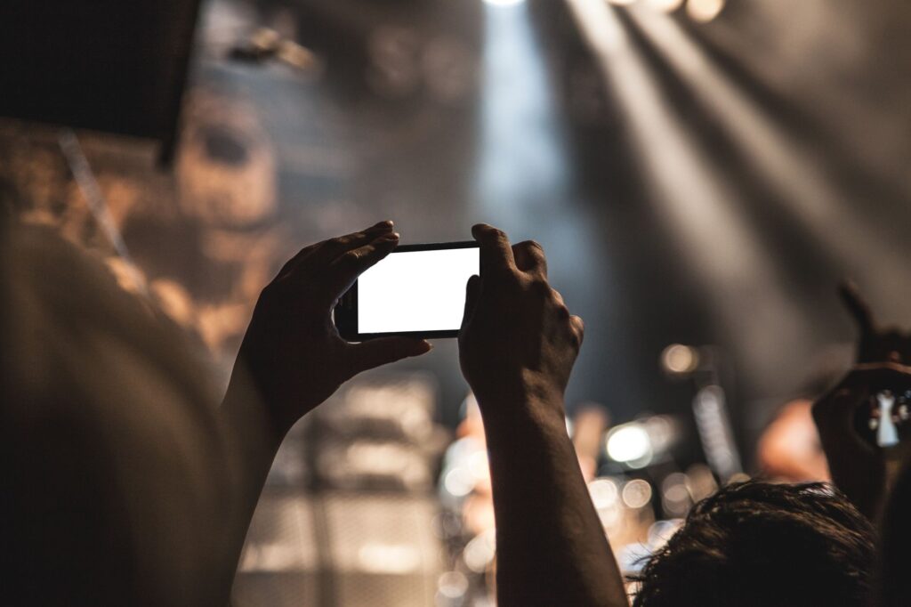 A scene showing a person taking photos of an accident scene as part of their injury claim checklist.