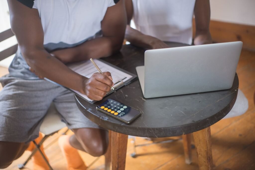 A visual of people discussing their injury claims with a calculator in the background. — online injury claim calculators