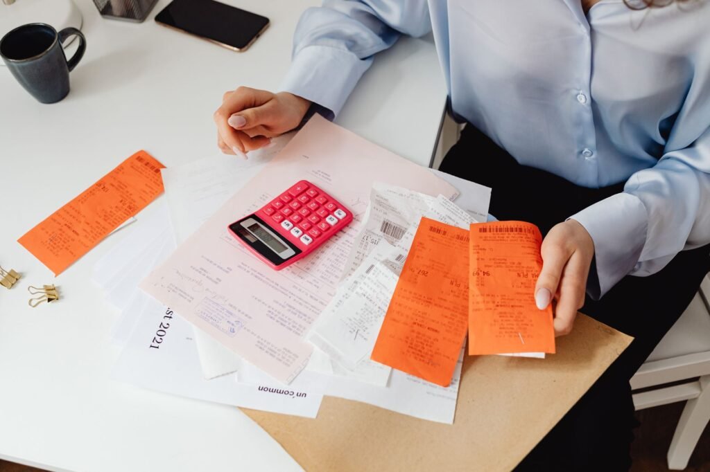 An image depicting a person reviewing their expenses related to an injury. — evidence for injury claim