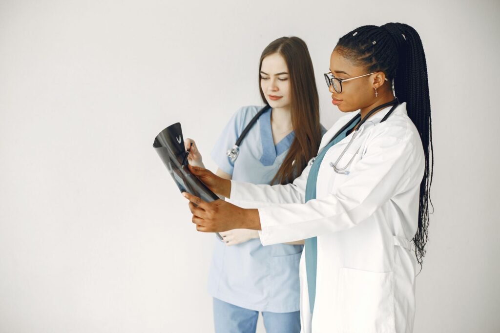 An image of a healthcare professional reviewing medical bills with a patient. — medical expenses injury claim