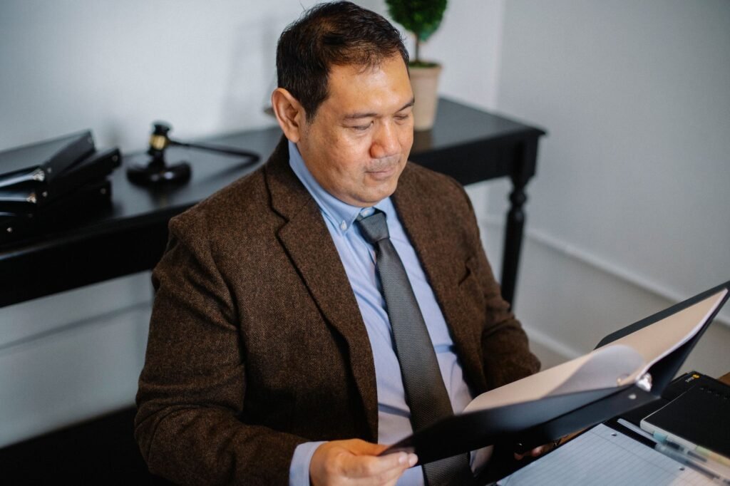 An image of a legal professional reviewing injury claim documents. — injury claim documentation