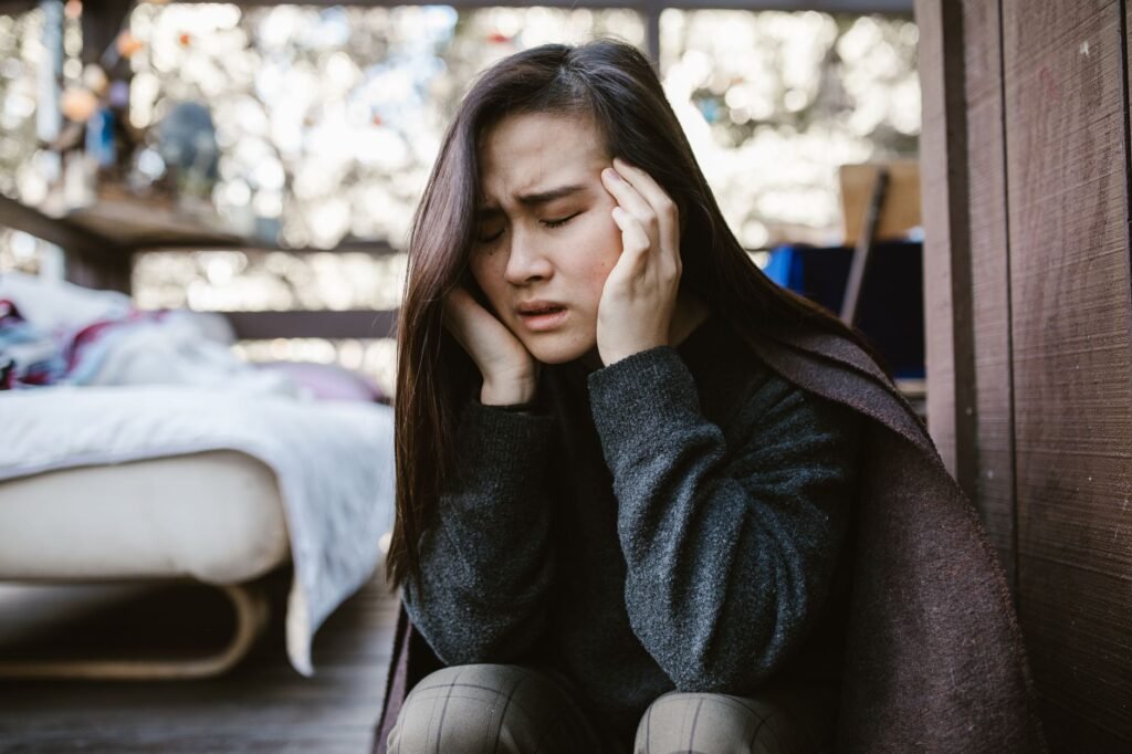 An image of a person experiencing pain and suffering, representing emotional distress. — factors affecting injury claim …