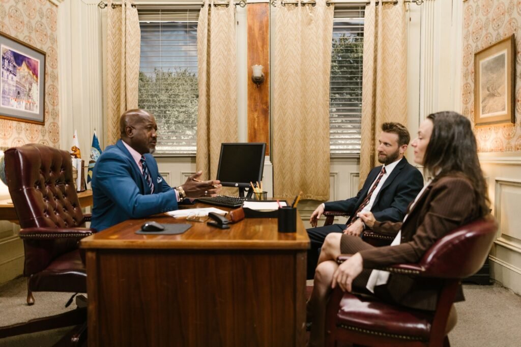 An image of a personal injury attorney consulting with a client about their pain and suffering injury claims.