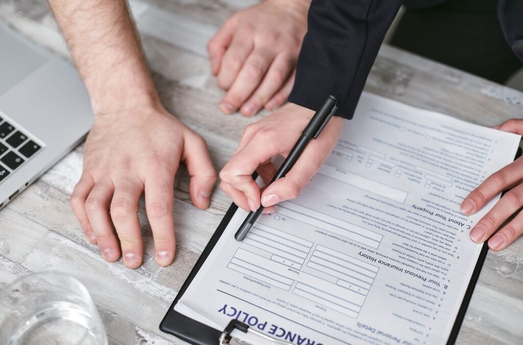 An image of an insurance adjuster reviewing a claim file. — insurance companies injury claims