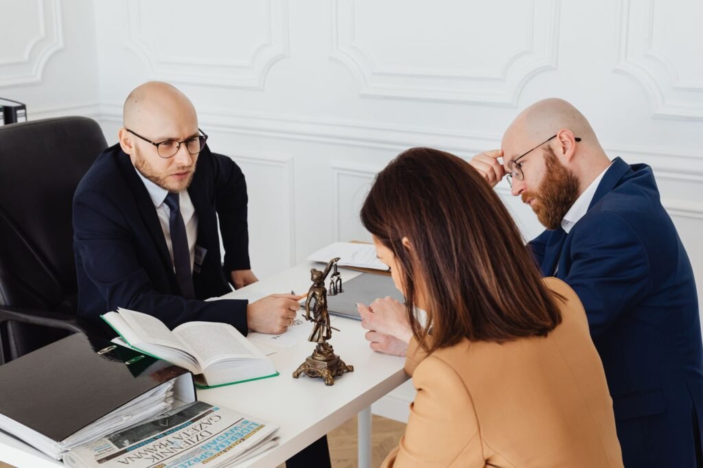 Image of a legal professional consulting with a client regarding their injury claim. — factors affecting injury claim