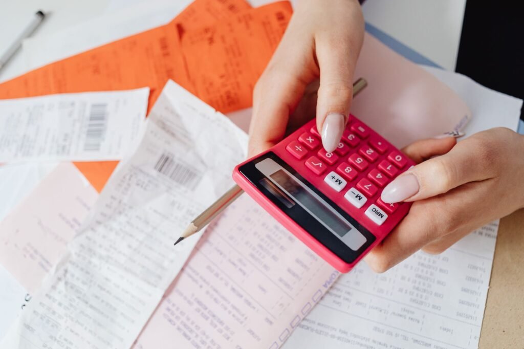Photo of a medical bill next to a calculator, symbolizing treatment costs. — factors affecting injury claim
