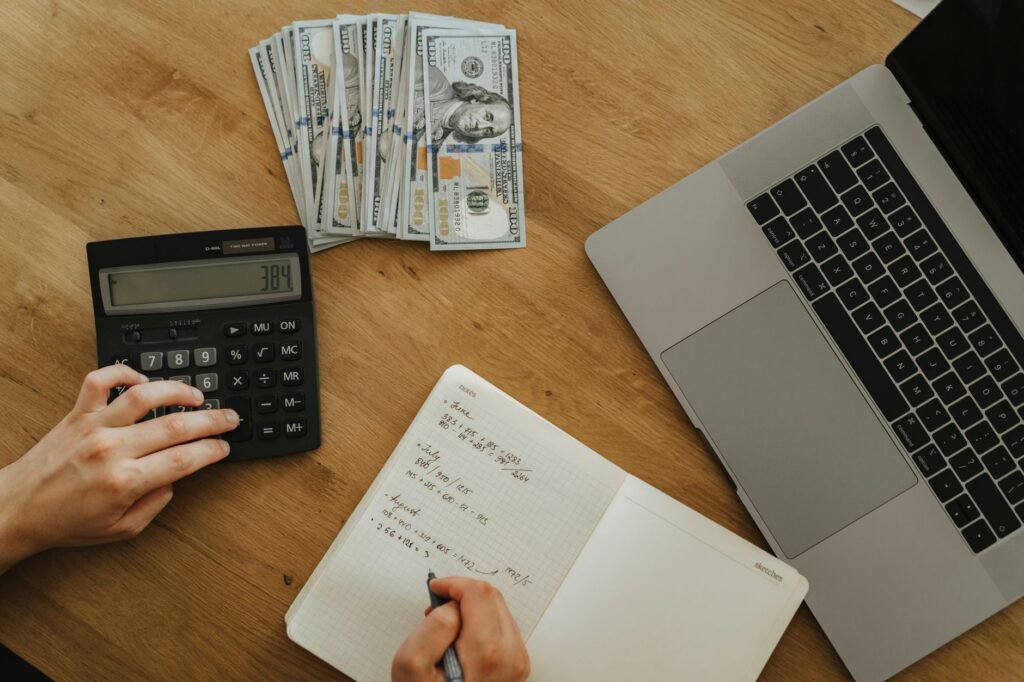 Photo of a person using a calculator for injury claims on a laptop — best injury claim calculator