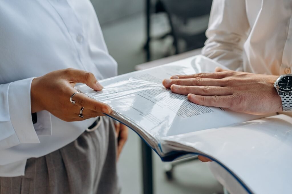 An organized folder containing essential documents for an injury claim consultation. — prepare for injury claim consulta…